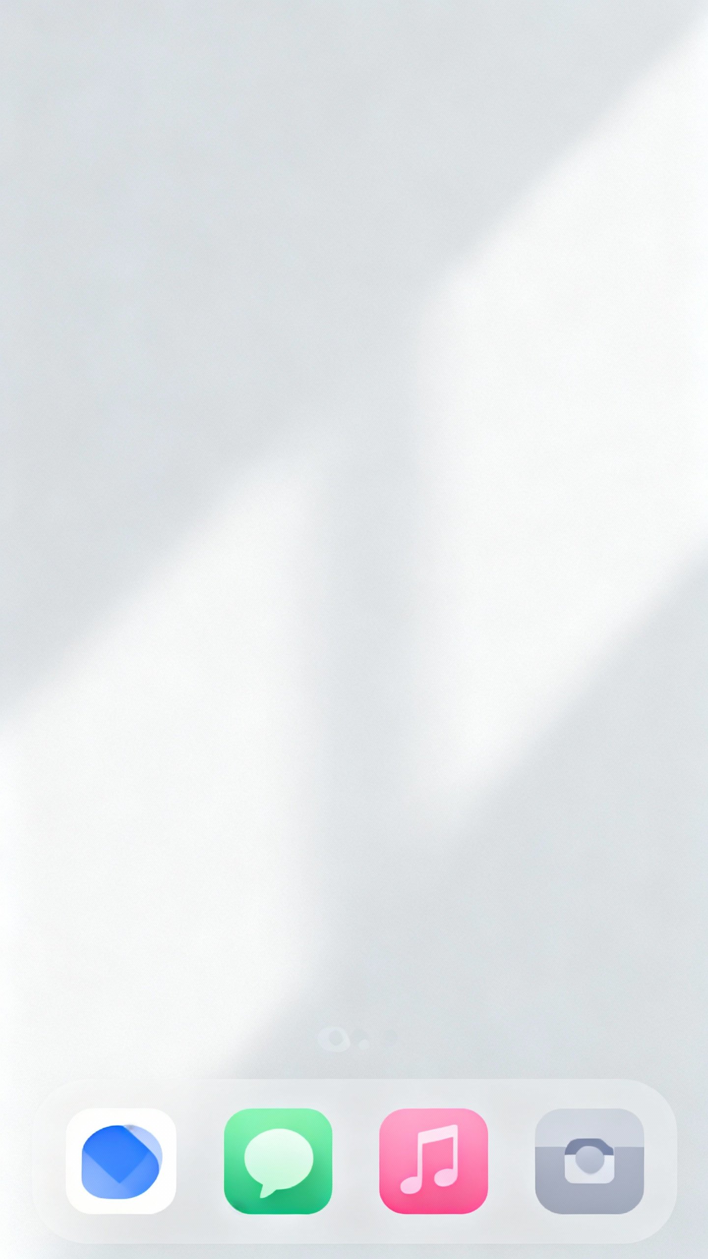 Closeup of smartphone home screen, minimal icons, badge counts off