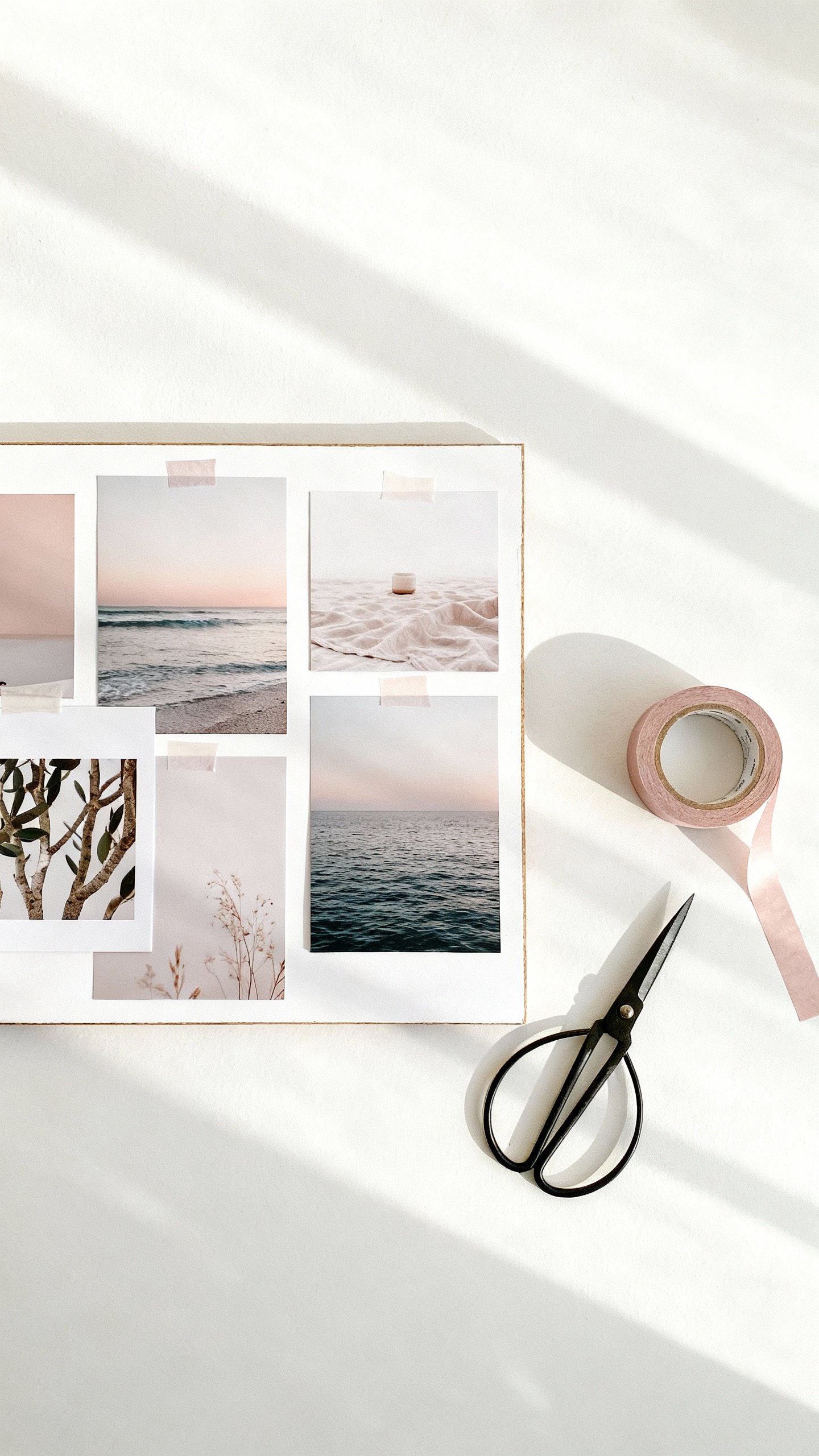 Minimal vision board with calming photos, washi tape, scissors