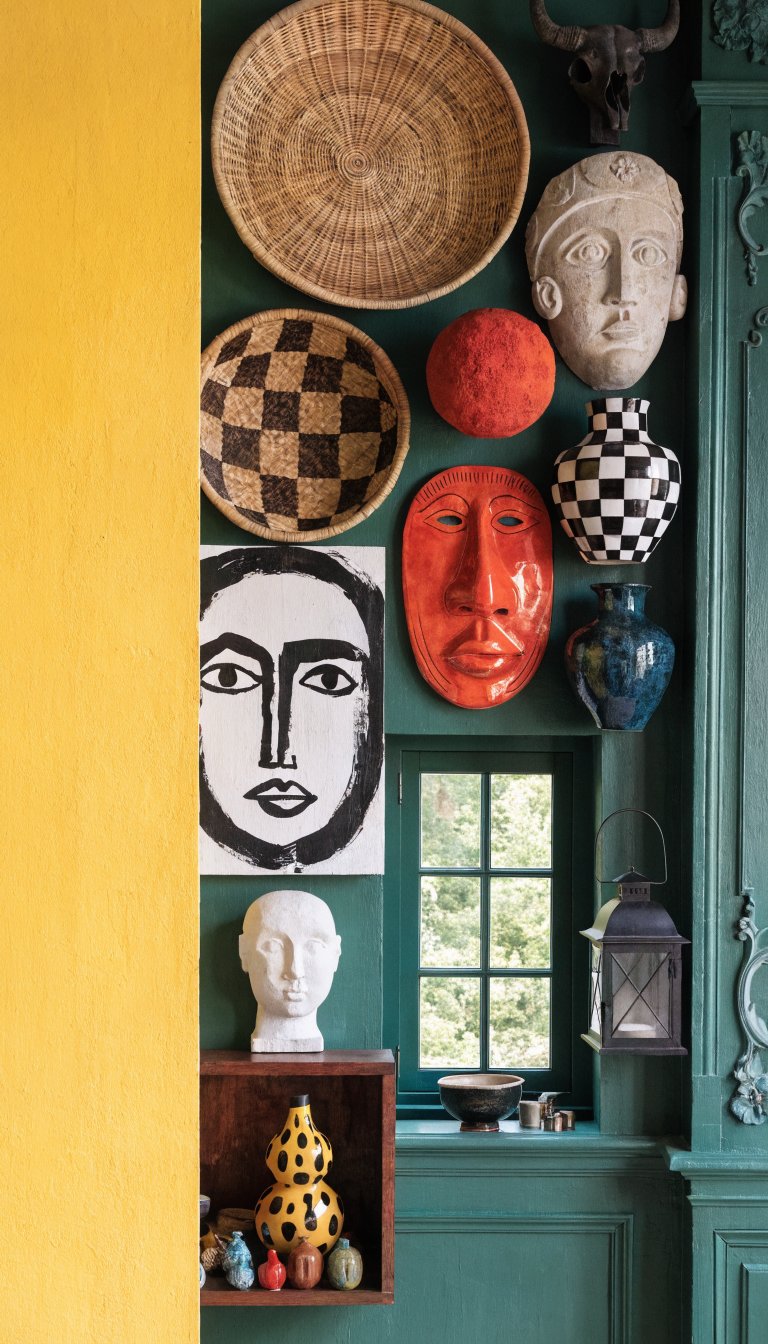 Bold yellow accent wall swatch beside maximalist gallery wall